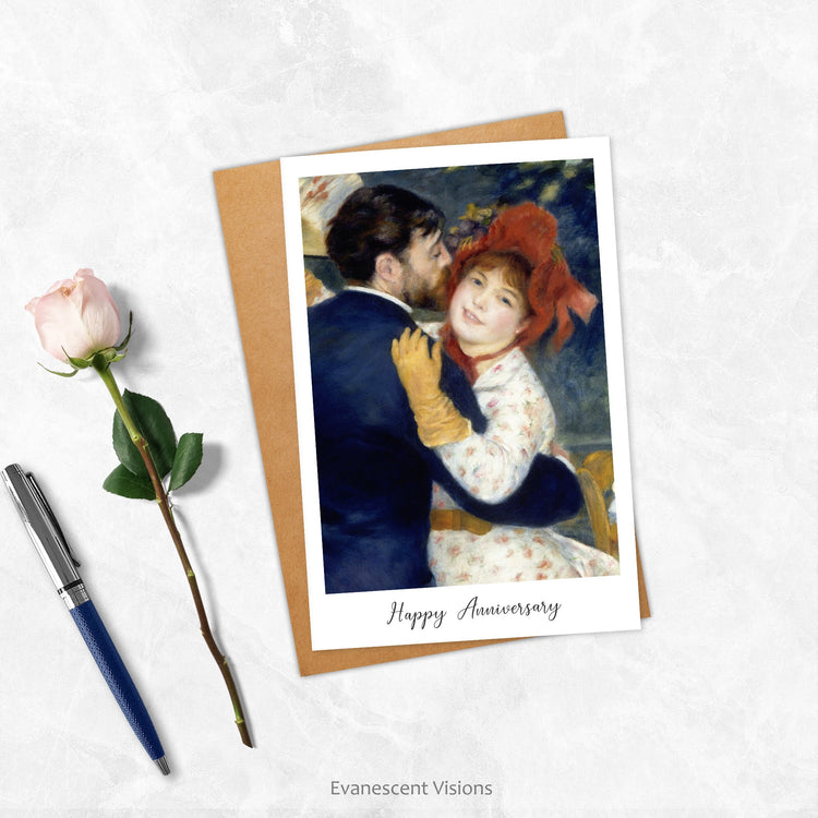 An Evanescent Visions personalised Anniversary card on a marble surface with a rose and a pen