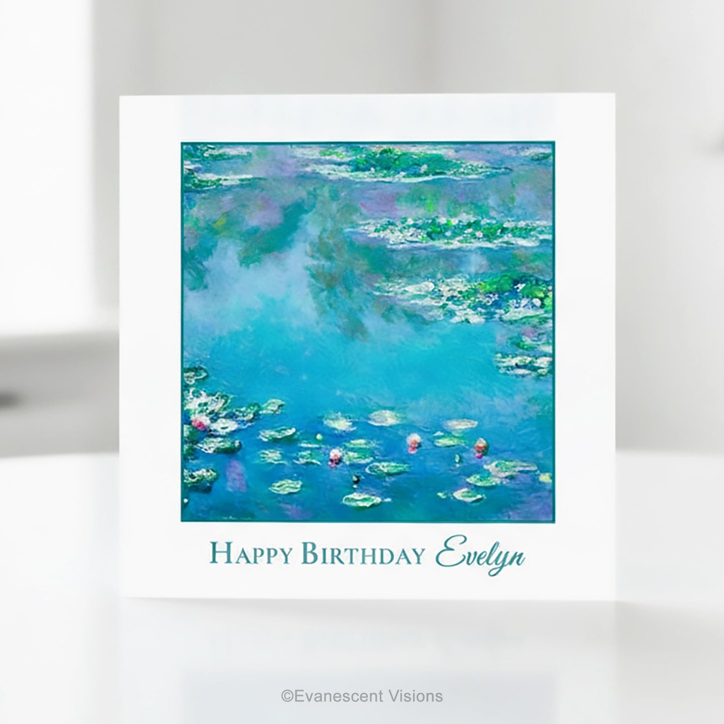 A square greeting card with a white border featuring Claude Monet's impressionist Water Lilies painting in blue, green, and purple tones, with the text 'Happy Birthday Evelyn' printed below.