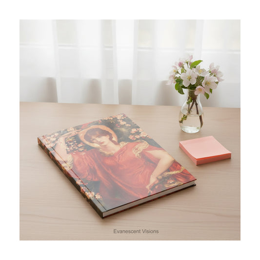 A hardcover notebook with a print of painting 'Fiammetta' by Rossetti, laying on a wood desk.