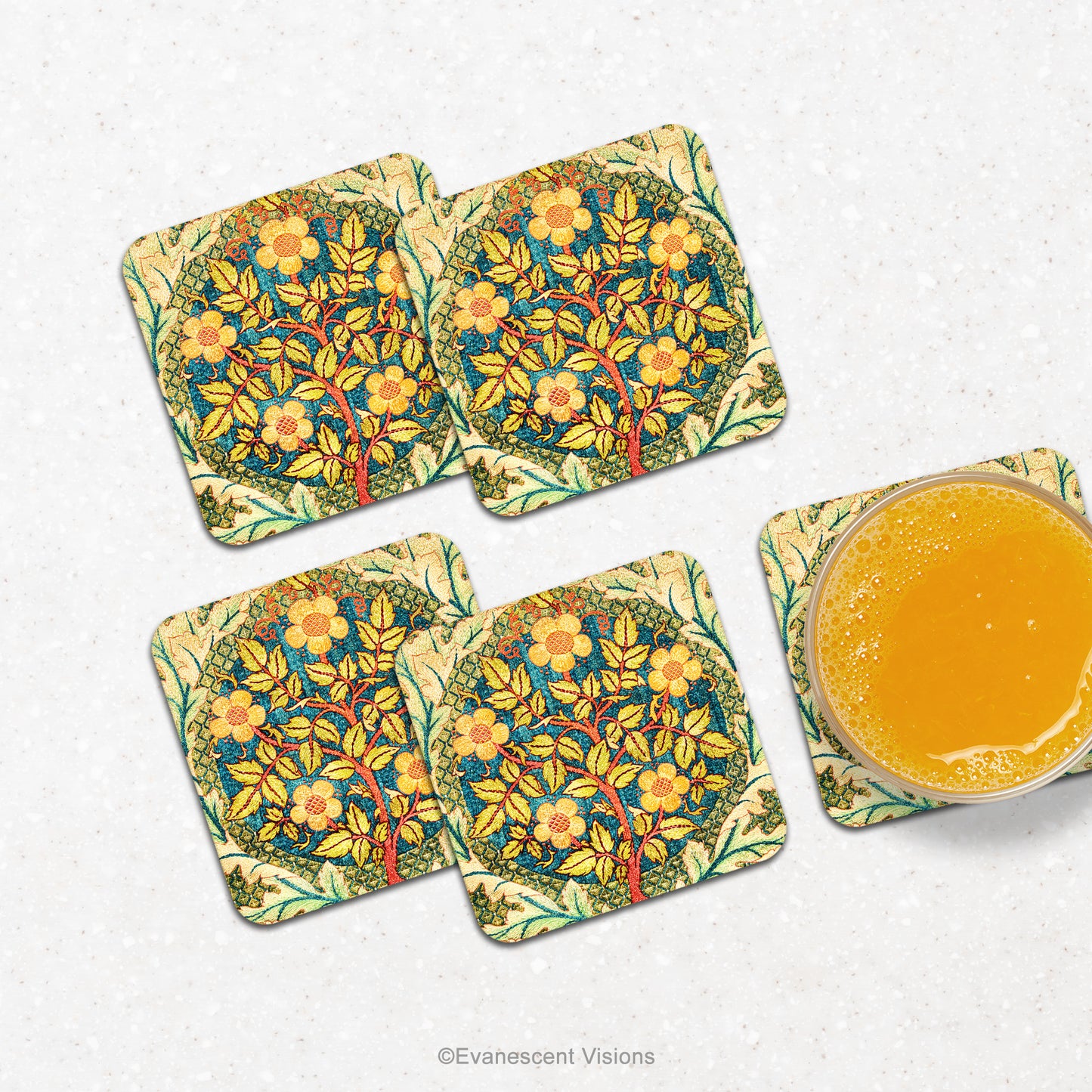 William Morris Rose Wreath Drinks Coasters on a counter wtih a glass of orange juice.