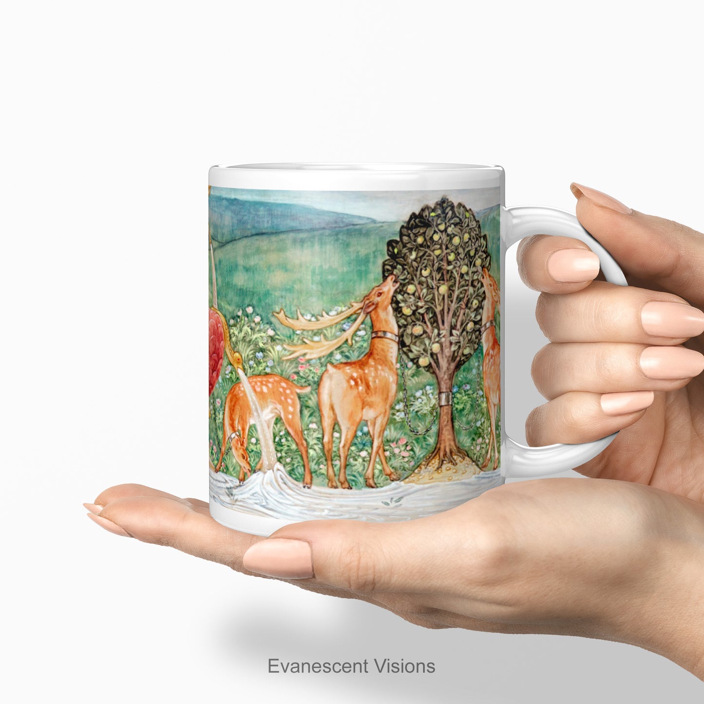 A hand holding the Pre-Raphaelite Fine Art Mug | Edward Burne-Jones Deer by a Fountain
