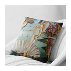 A square cushion  featuring a classical art print of 'The Birth of Venus' by Sandro Botticelli, shown on a white armchair. 