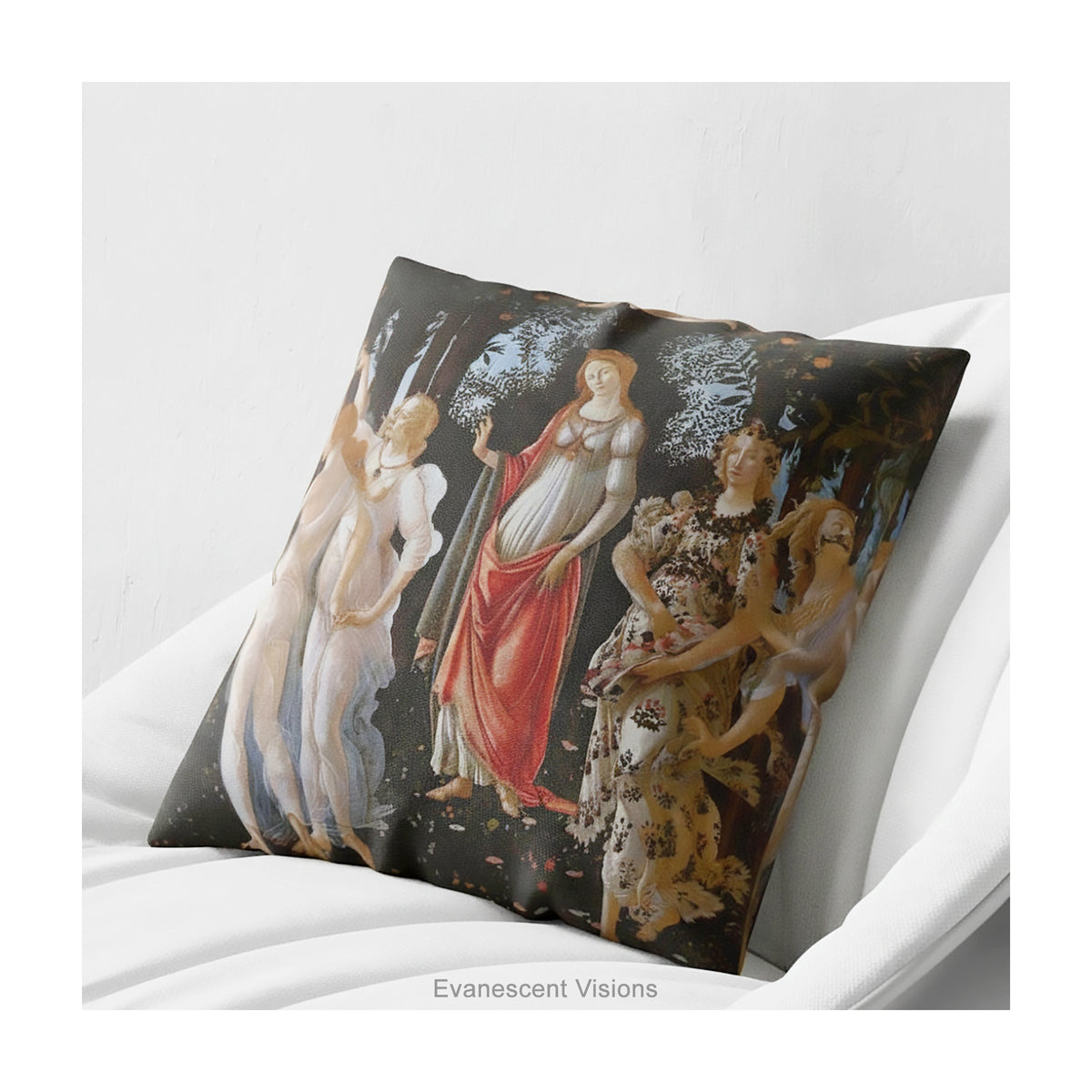 A square decorative cushion with a print of the classical painting 'La Primavera' by Sandro Botticelli, shown on a white armchair. 