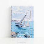 A hardcover notebook standing on a white desk,  depicting a white sailboat sailing on blue water under a cloudy sky, from painting 'Sailing' by Danielson-Gambogi