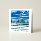 Winter Moonlight Season's Greetings Traditional Christmas Card on a white surface.