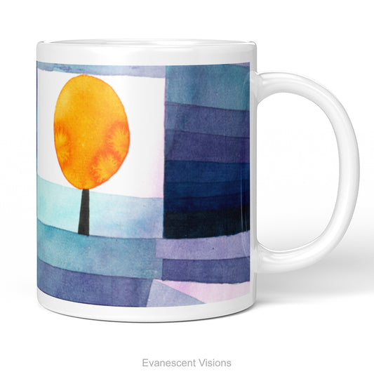 A white ceramic mug featuring a watercolor-style abstract landscape print called 'Harbinger of Autumn' by Paul Klee, with a bright orange sun, a black tree trunk, and layered blue, purple, and navy sky-like stripes. 