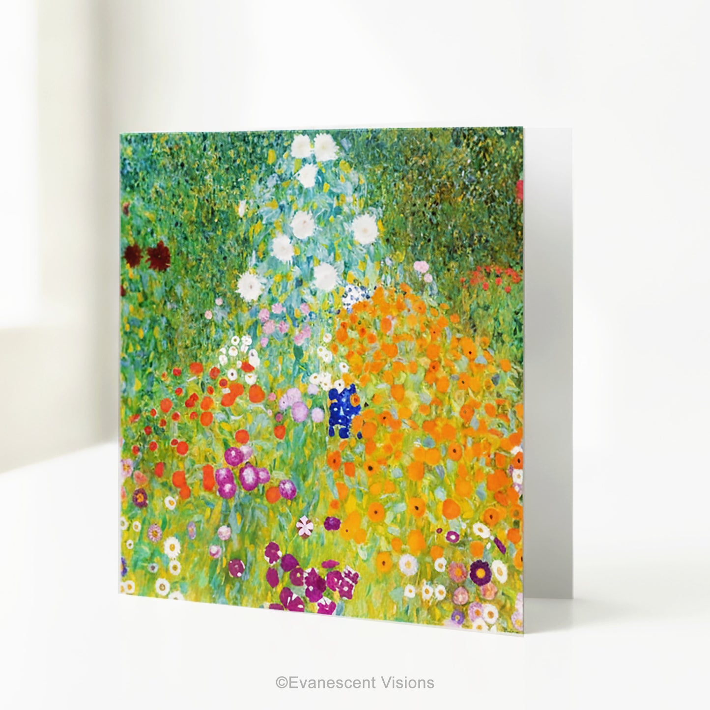A square art print greeting card with Gustav Klimt arwork 'Bauergarten'   a colorful impressionist-style wildflower meadow, standing on a white table.