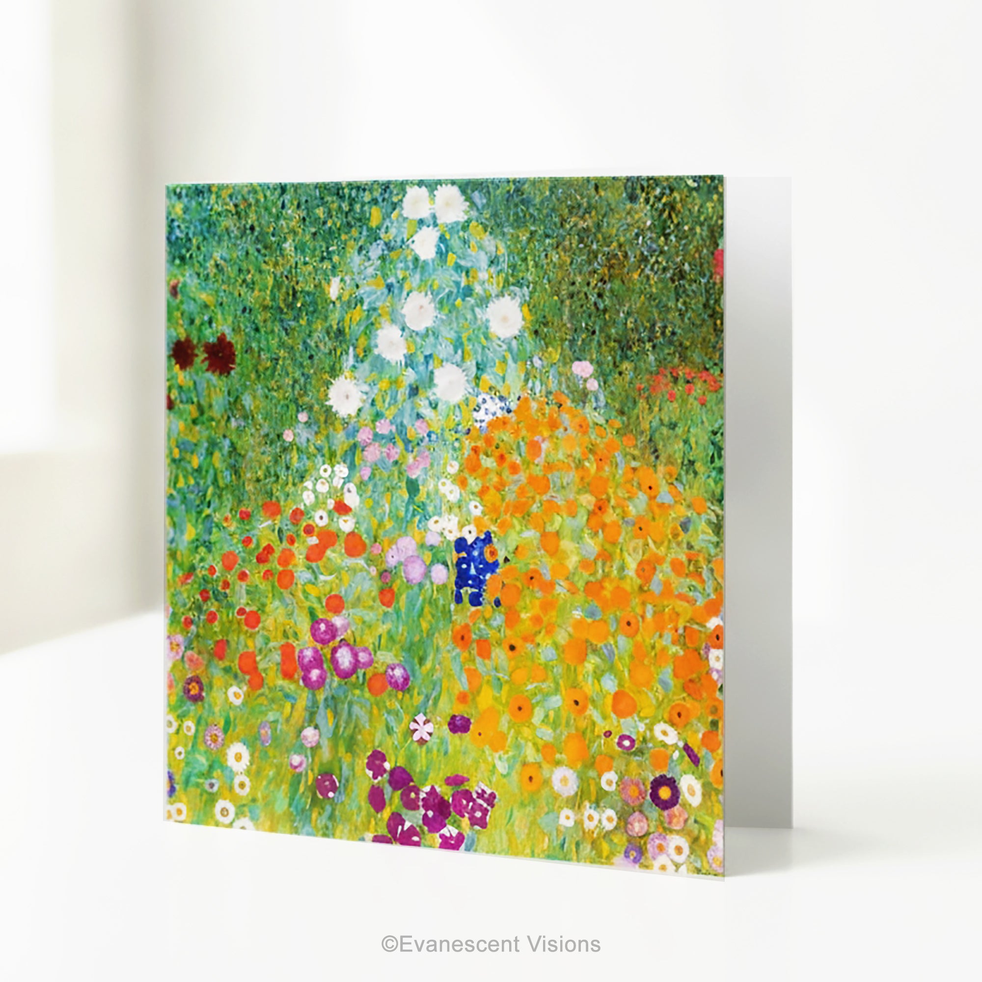 A square art print greeting card with Gustav Klimt arwork 'Bauergarten'   a colorful impressionist-style wildflower meadow, standing on a white table.