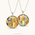 Front and back views of a double sided pendant necklace with pattern detail from artwork 'The Kiss' by Alphonse Mucha