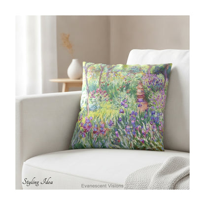 A square decorative cushion  featuring an impressionist floral artwork 'The Artist's Garden' by Claude Monet, on cream coloured sofa.