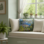 A square throw pillow printed with with Claude Monet's 'Bordighera' landscape painting, shown styled on a window seat. 