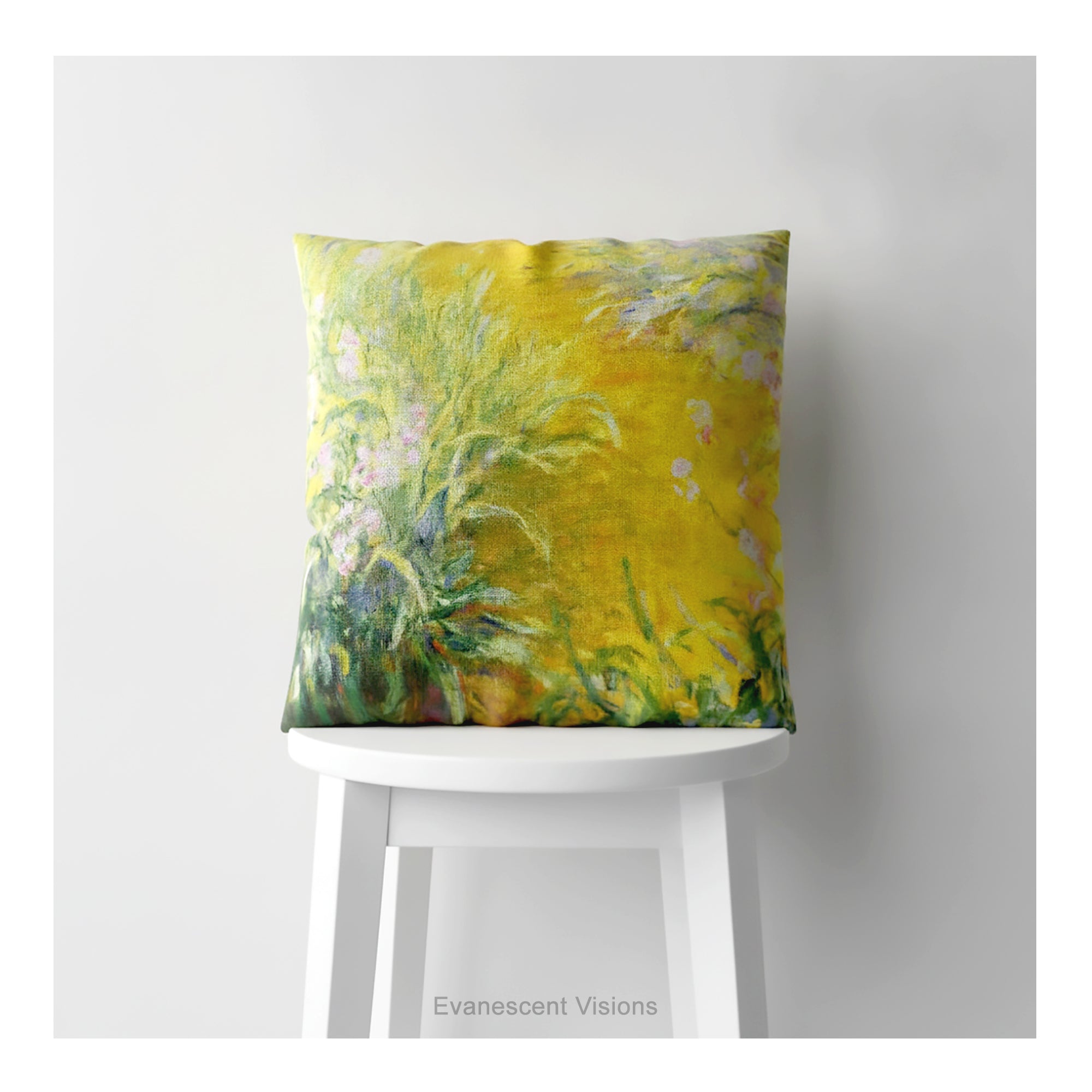 A decorative square cushion on a white stool, printed with impressionist floral painting 'The Path Through the Irises' by Claude Monet. 