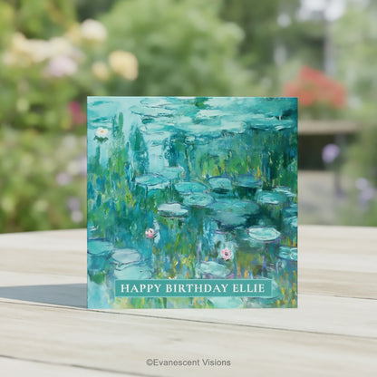 A square greeting card featuring an impressionistic Water Lilies painting by Claude Monet in teal, green, and blue tones with pink water lilies, on a table in a garden.