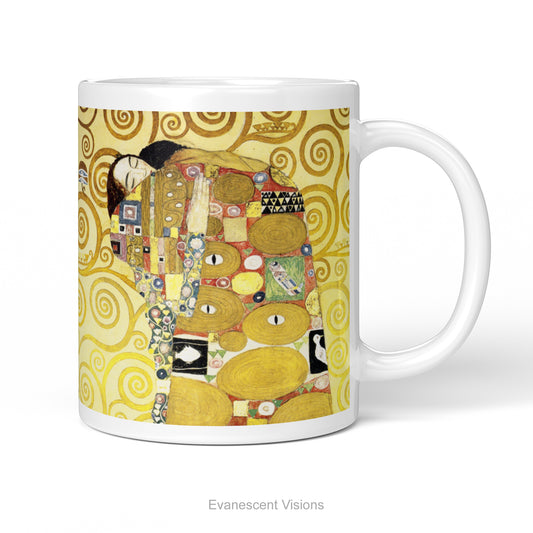 A white ceramic mug featuring Gustav Klimt's 'The Embrace' artwork, shown standing against a  white background.