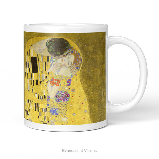 A white ceramic mug featuring a print of  Gustav Klimt's 'The Kiss' painting shown on a white background.