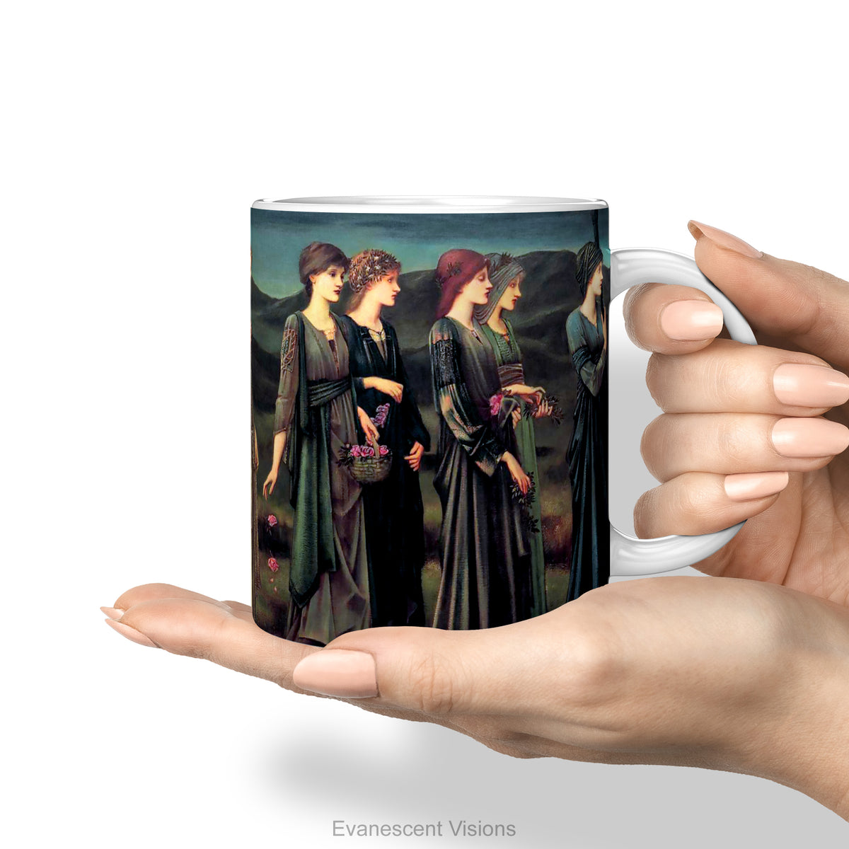 A hand holds a white ceramic mug featuring a print of Burne-Jones painting 'Psyche's Wedding, 