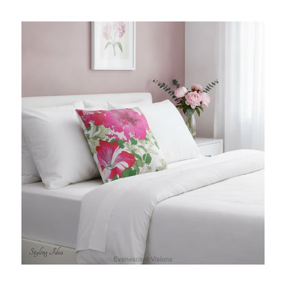 A square pillow with a vibrant floral print  of Vintage petunia flowers  by artist Tanigami Kônan, shown on a white bed.