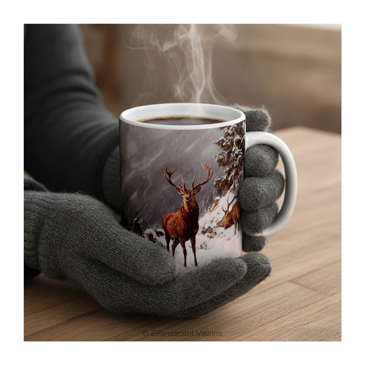 Gloved hands holding A ceramic mug featuring artwork ' Red deer grazing in a mountainous winter landscape' by Arthur Thiele