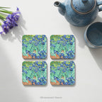 Set of 4 coasters with the painting 'Irises' on the front, by Van Gogh, shown on a table with tableware.