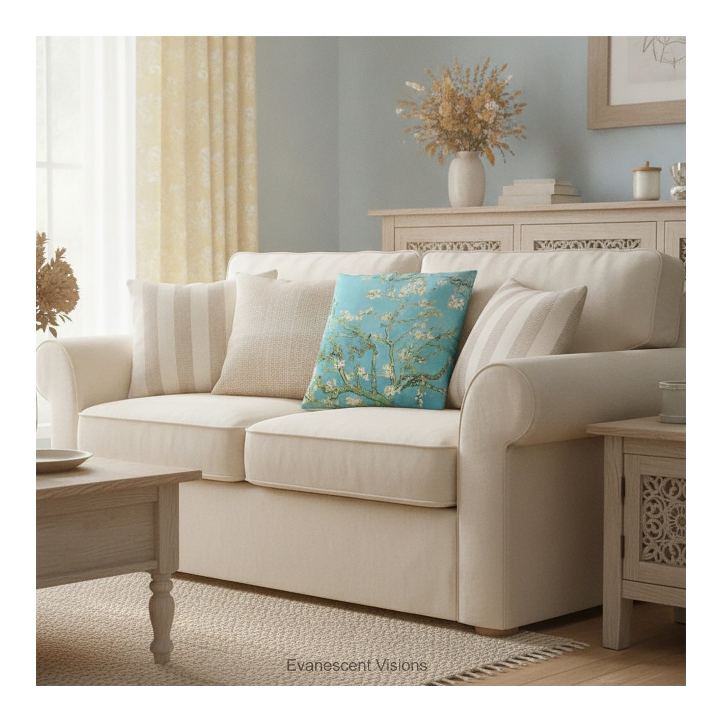 A square decorative cushion featuring Vincent van Gogh's 'Almond Blossom' painting design,  shown styled on a cream coloured sofa.