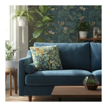 A square decorative cushion  with design 'Cock Pheasant ' by William Morris, on a blue sofa in a botanical themed room. 