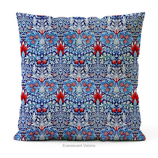 A square  cushion featuring  intricate William Morris pattern Snakeshead,  in blue, red, and white, 