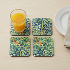 Set of four coasters printed with detail from the design  'Cock Pheasant' by William Morris, shown on a table.