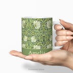 Hands holding the Pimpernel personalised ceramic mug. 