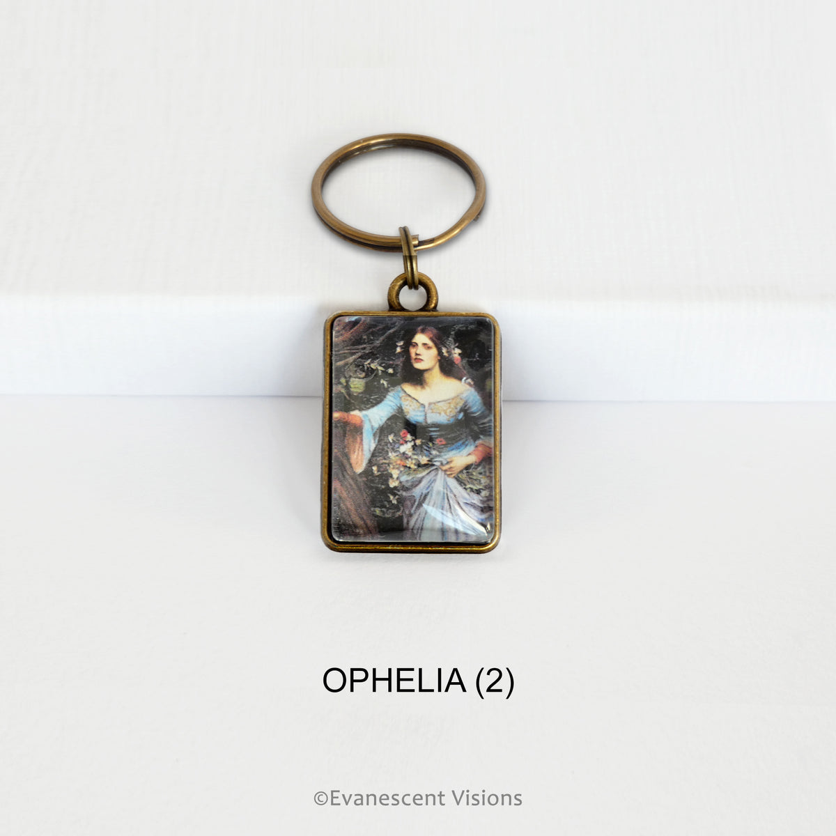 Pre-Raphaelite art keyring with artwork 'Ophelia' by John William Waterhouse, on a white background