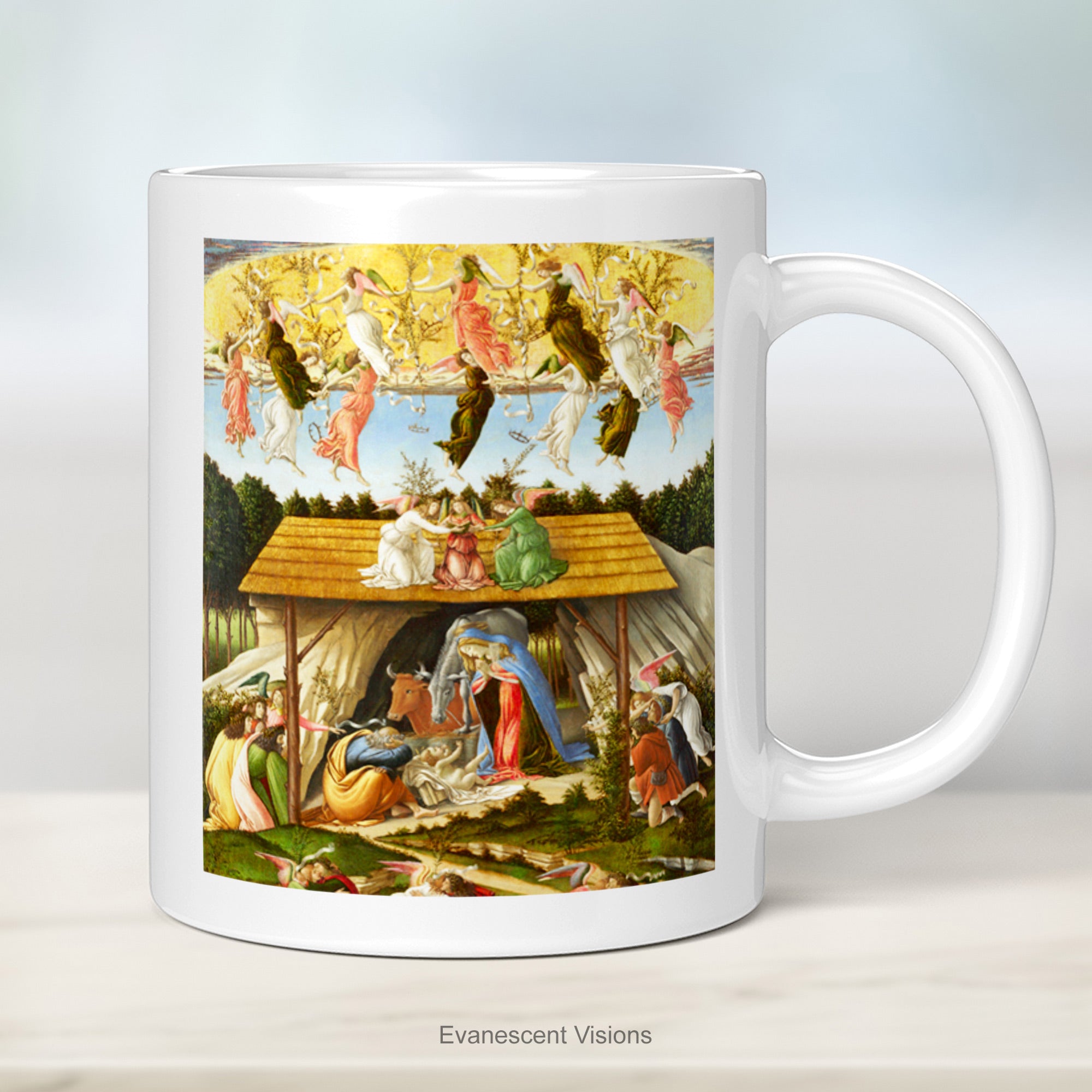 A white ceramic mug with a print of the nativity scene painting 'Mystic Nativity' by Sandro Botticelli, shown on a plain kitchen counter.