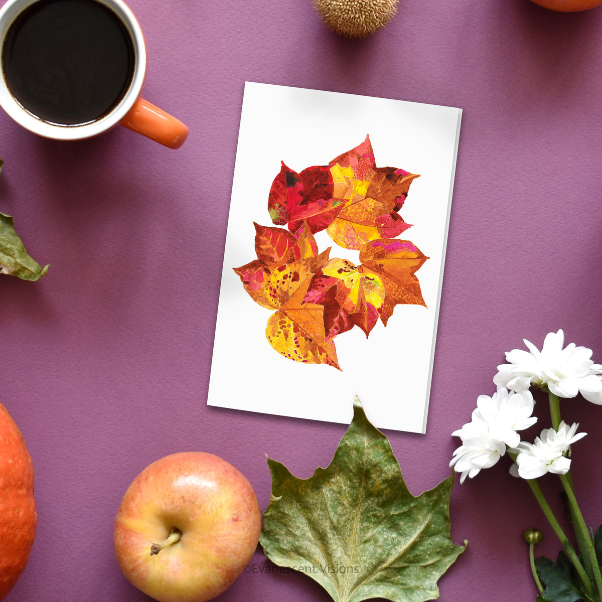Evanescent Visions Autumn Fall Leaves Greeting Card on table with plants